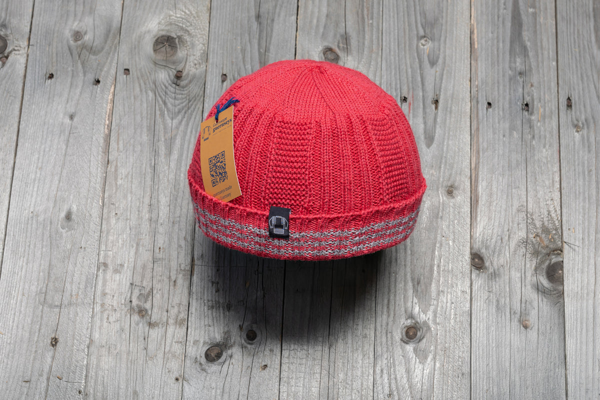 Red wool Hanois beanie with a ribbed knit, turn-back cuff, and three integrated reflective silver bands.